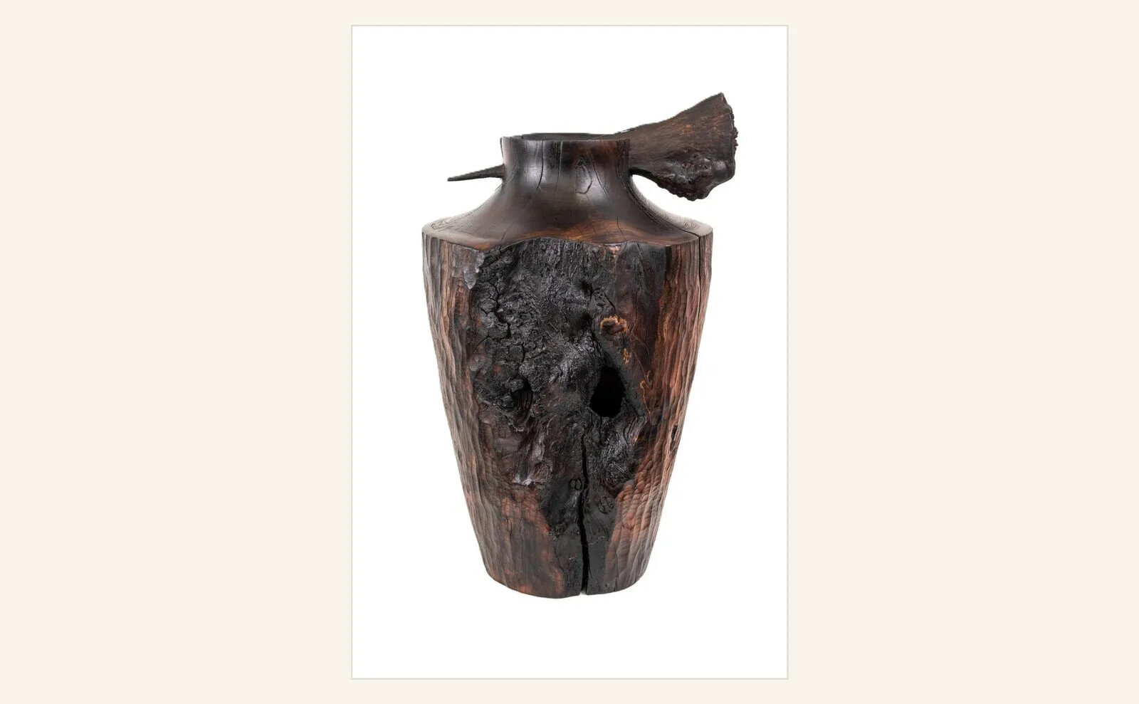Julian Emsley, Barriers in Yew II, 2025, a dark burnt and waxed sculpture made from garden yew felled for safety.