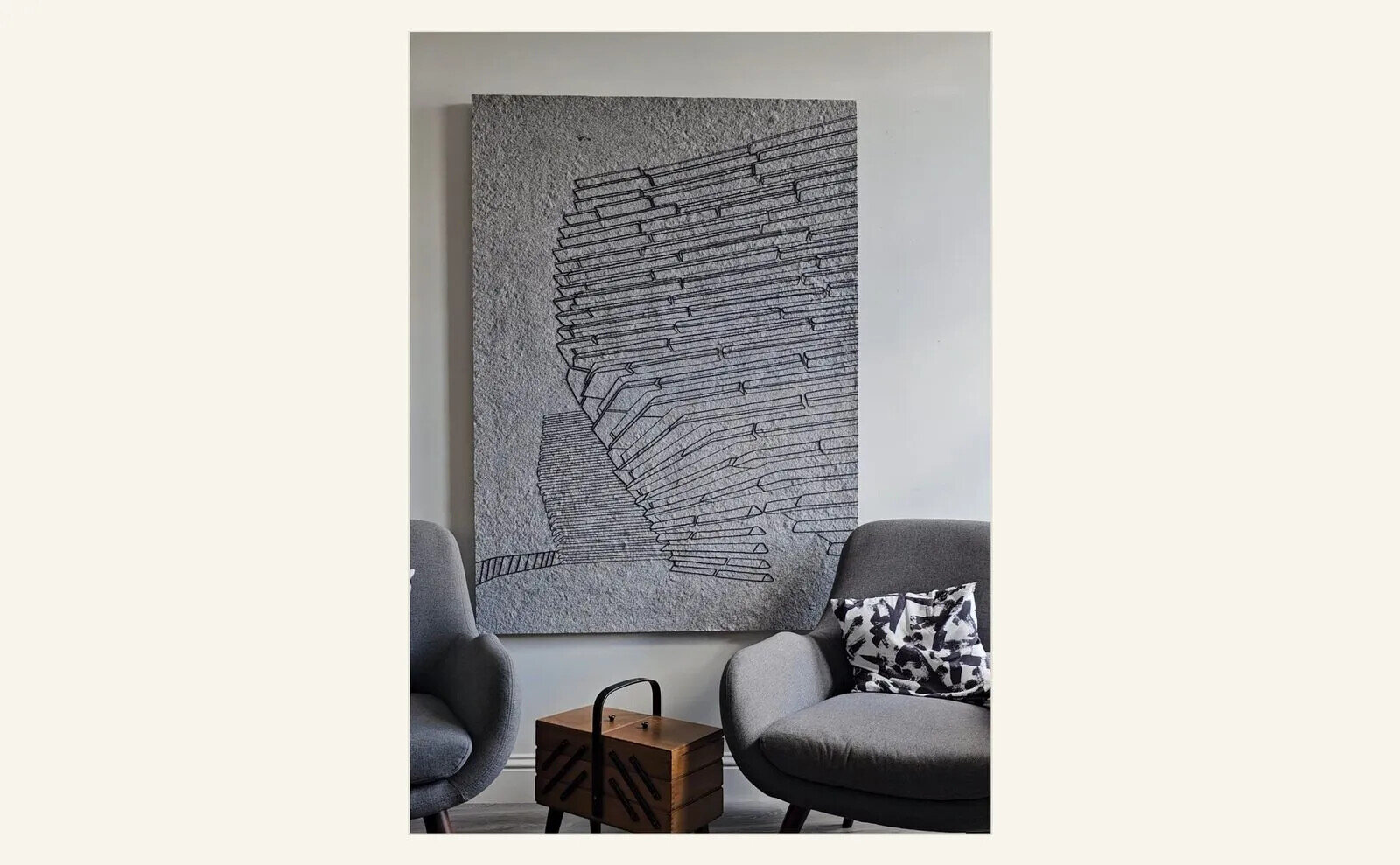 Sandra Junele, 3552, 2024, a large neutral-toned contemporary textile artwork made with reclaimed materials and installed above seating.